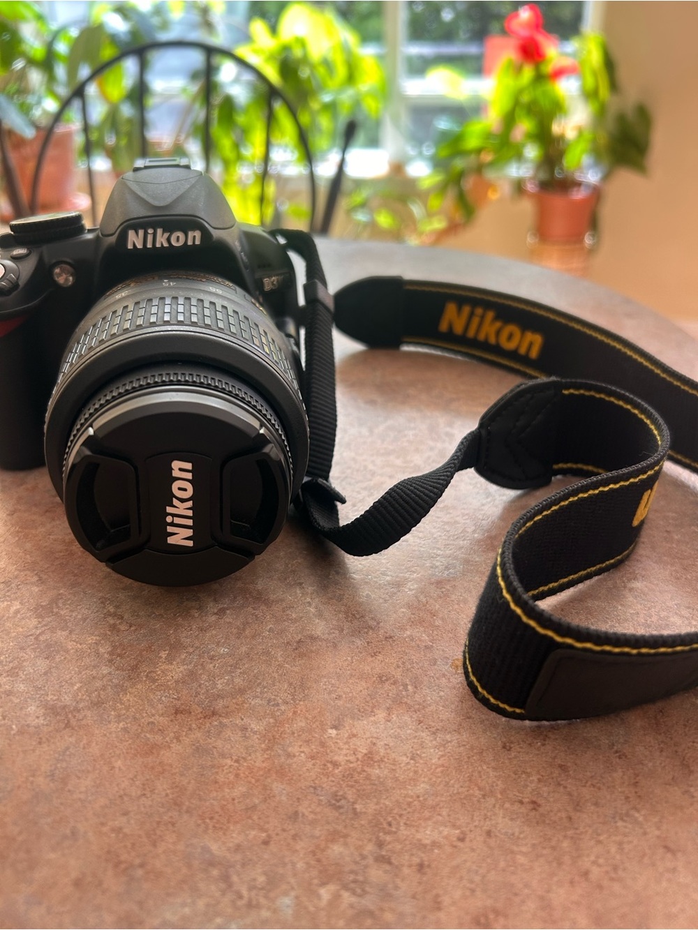 Nikon Black 3100 DSLR Camera with Zoom Lens and Branded Strap